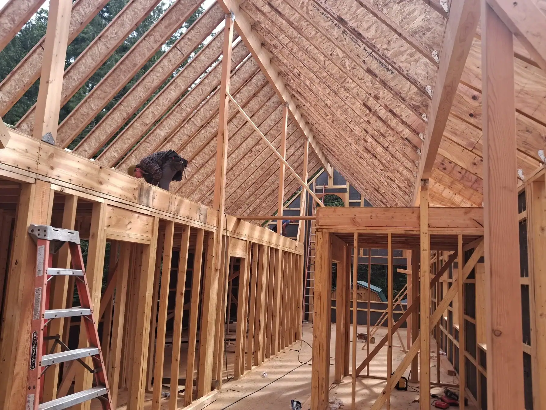Vaulted interior framing with exposed roof structure inside a Washington State custom home.