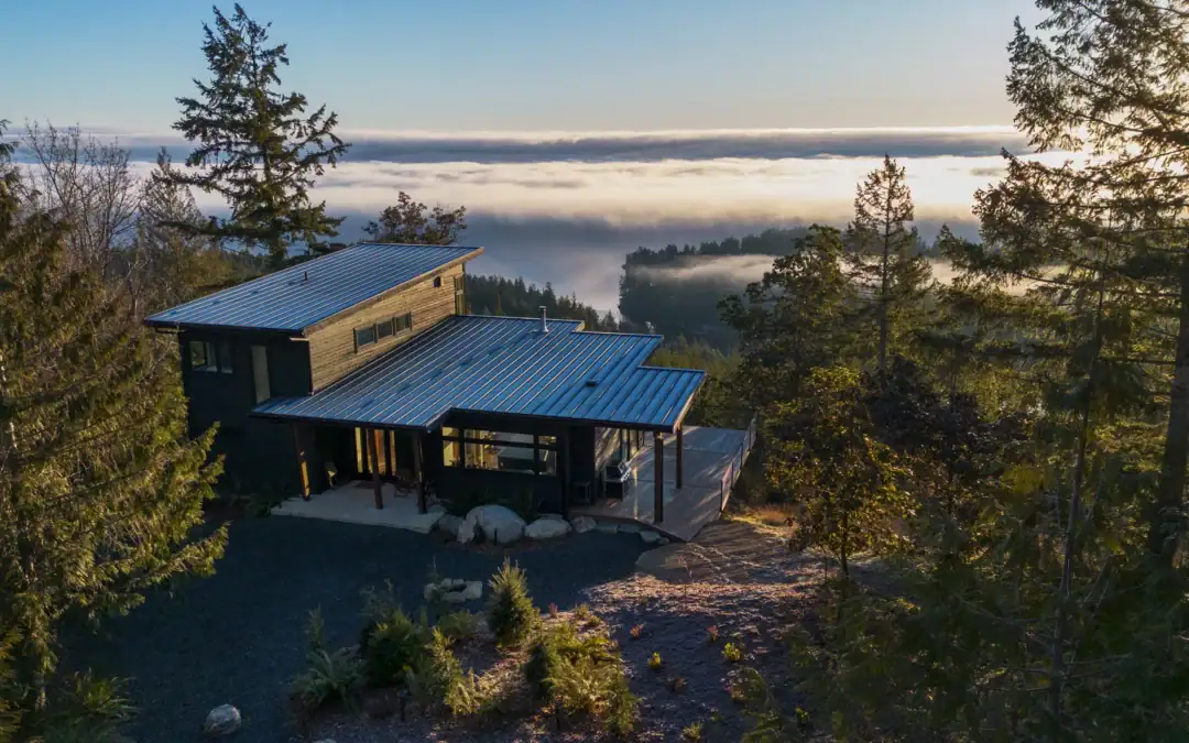 Tamlin custom home on a forested waterfront building lot overlooking the water
