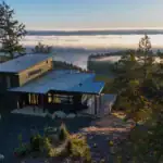 Tamlin custom home on a forested waterfront building lot overlooking the water